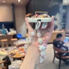 وقد وضعت سلسلة مفاتيح سلسلة مفاتيح سلسلة الهاتف الخلوي على محفظة سلسلة مفاتيح صغيرة details Picture